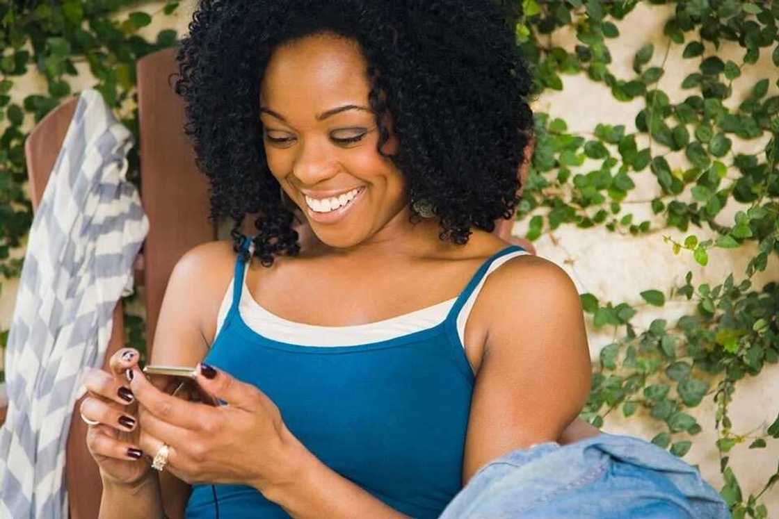 Happy woman texting Happy woman texting
