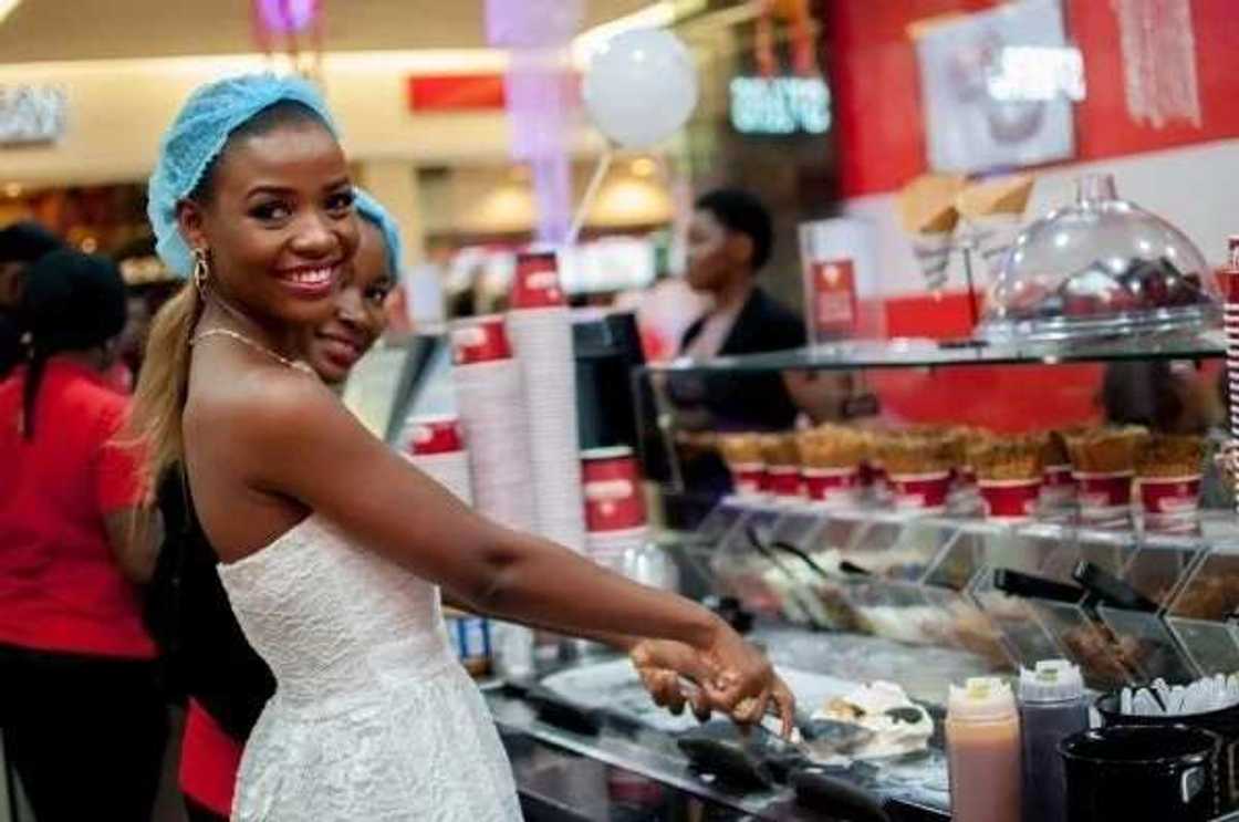 A girl buys an ice-cream A girl buys an ice-cream