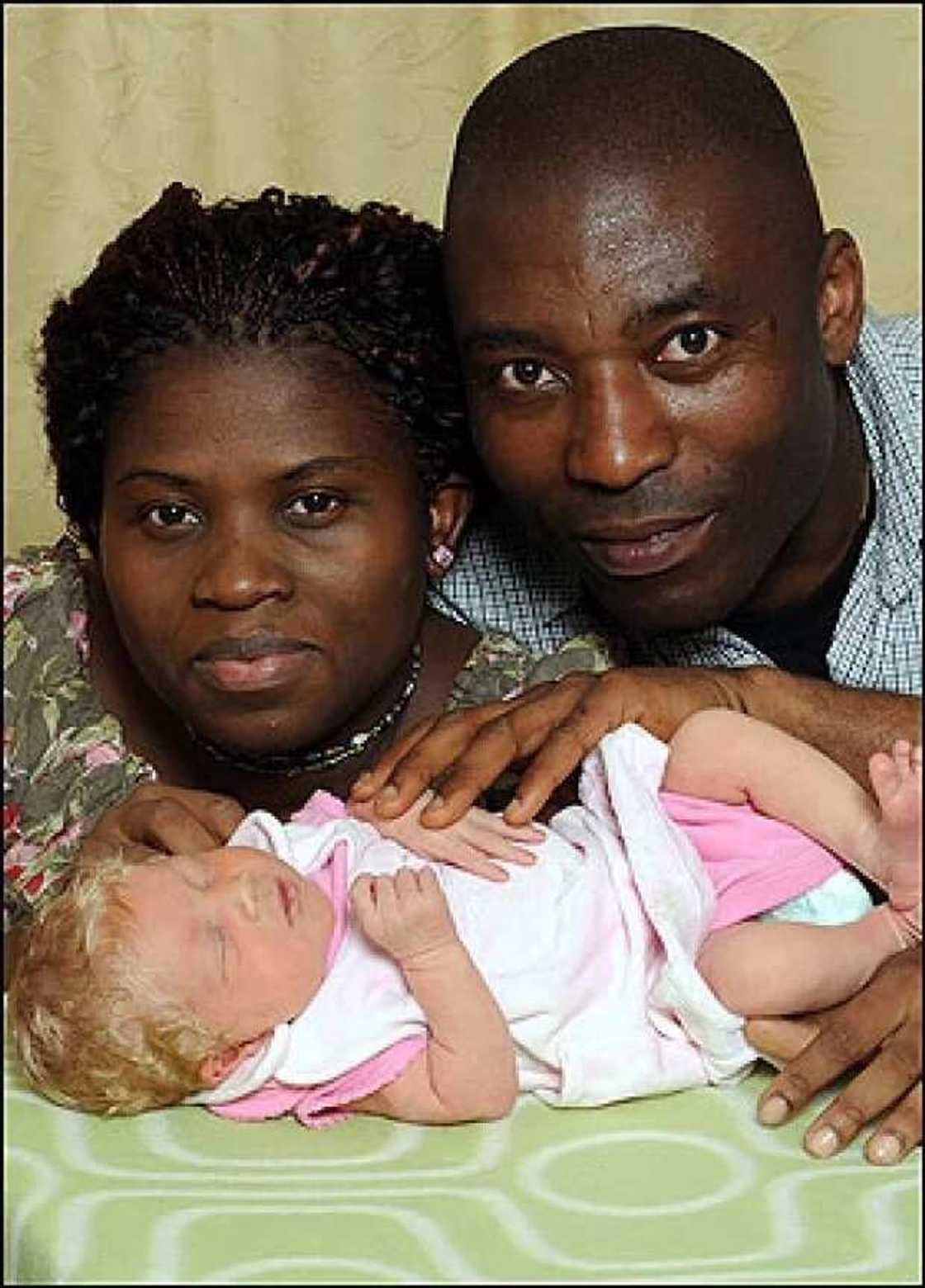 Black couple - white baby Black couple - white baby