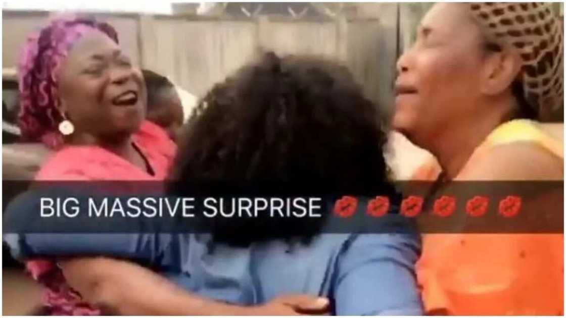 Happy mother rolls on the floor as daughter surprises Happy mother rolls on the floor as daughter surprises
