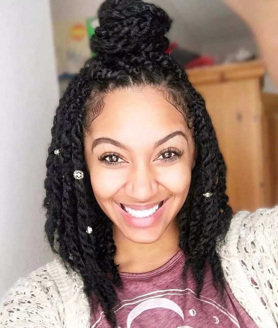 Natural hair twist style for long hair with a bun Natural hair twist style for long hair with a bun