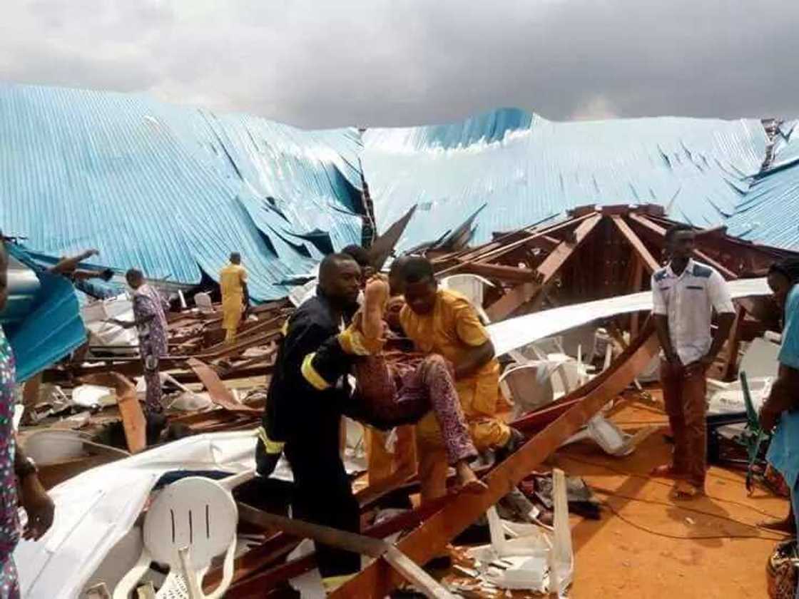 Rescue workers puling bodies from the wreckage Rescue workers puling bodies from the wreckage