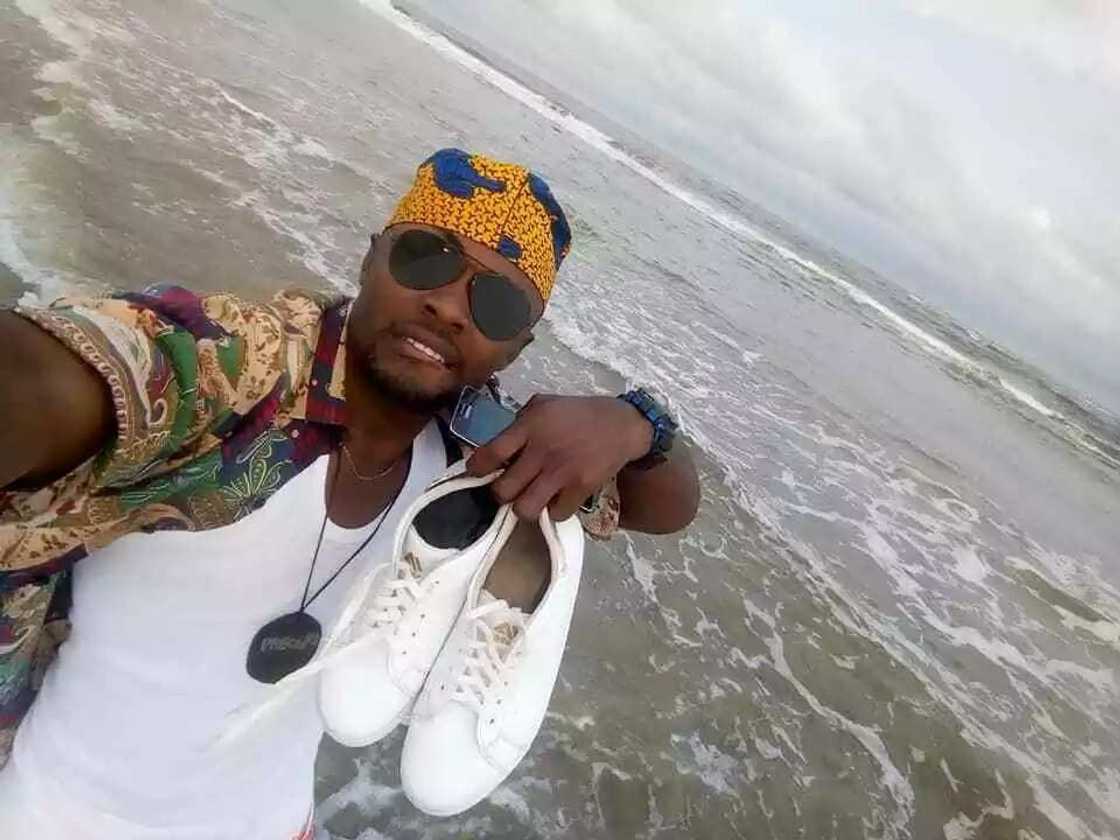 Reactions as choirmaster poses with his female friend on a beach in Akwa Ibom