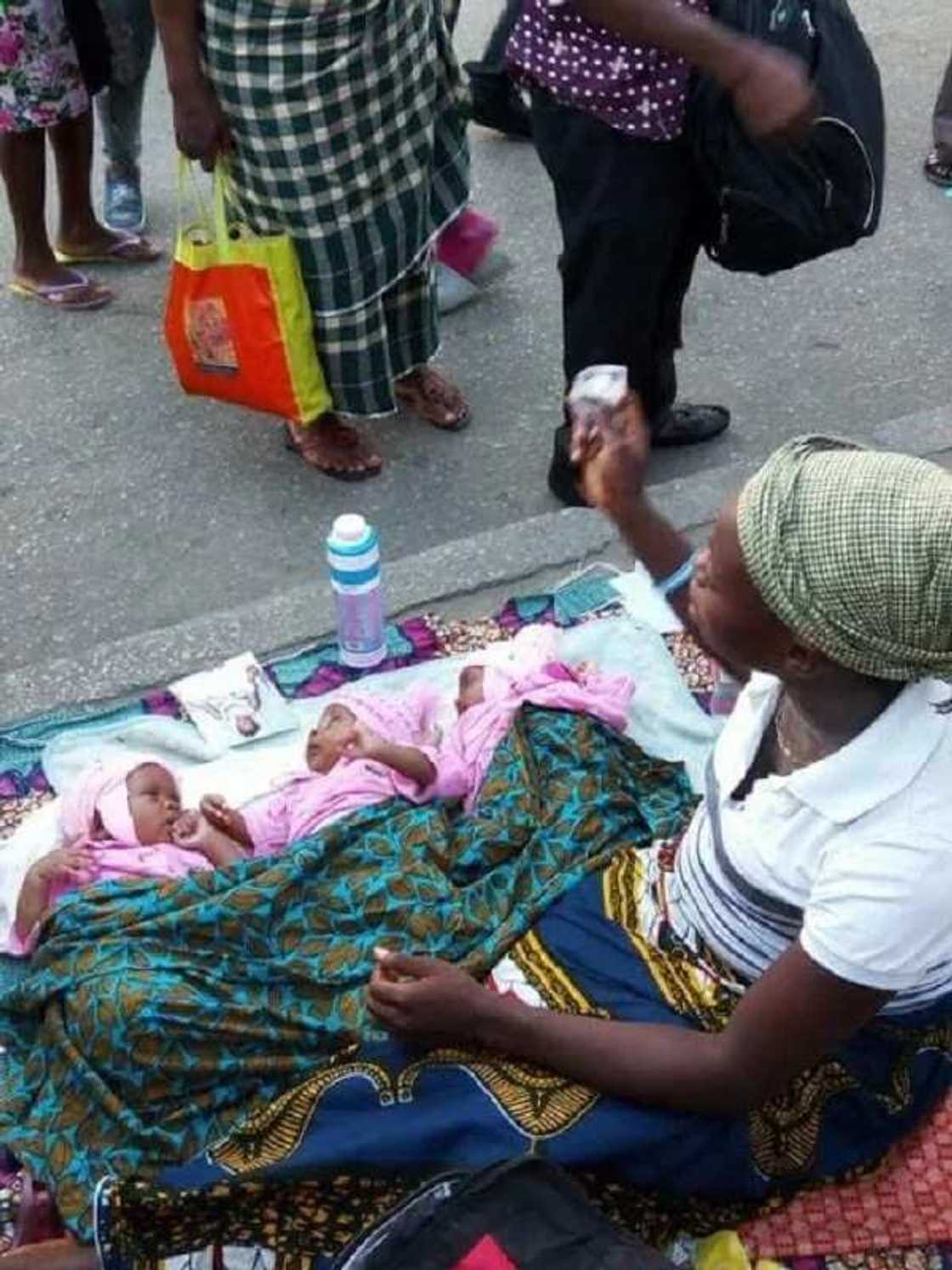 Sad! Woman and her new-born triplets beg on the Street of Port-Harcourt (Photos) Sad! Woman and her new-born triplets beg on the Street of Port-Harcourt (Photos)