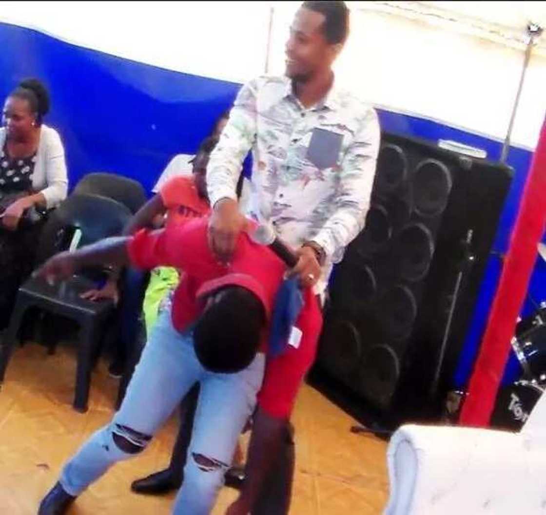 Pastor Penuel Mnguni rides member like a horse (photos) Pastor Penuel Mnguni rides member like a horse (photos)