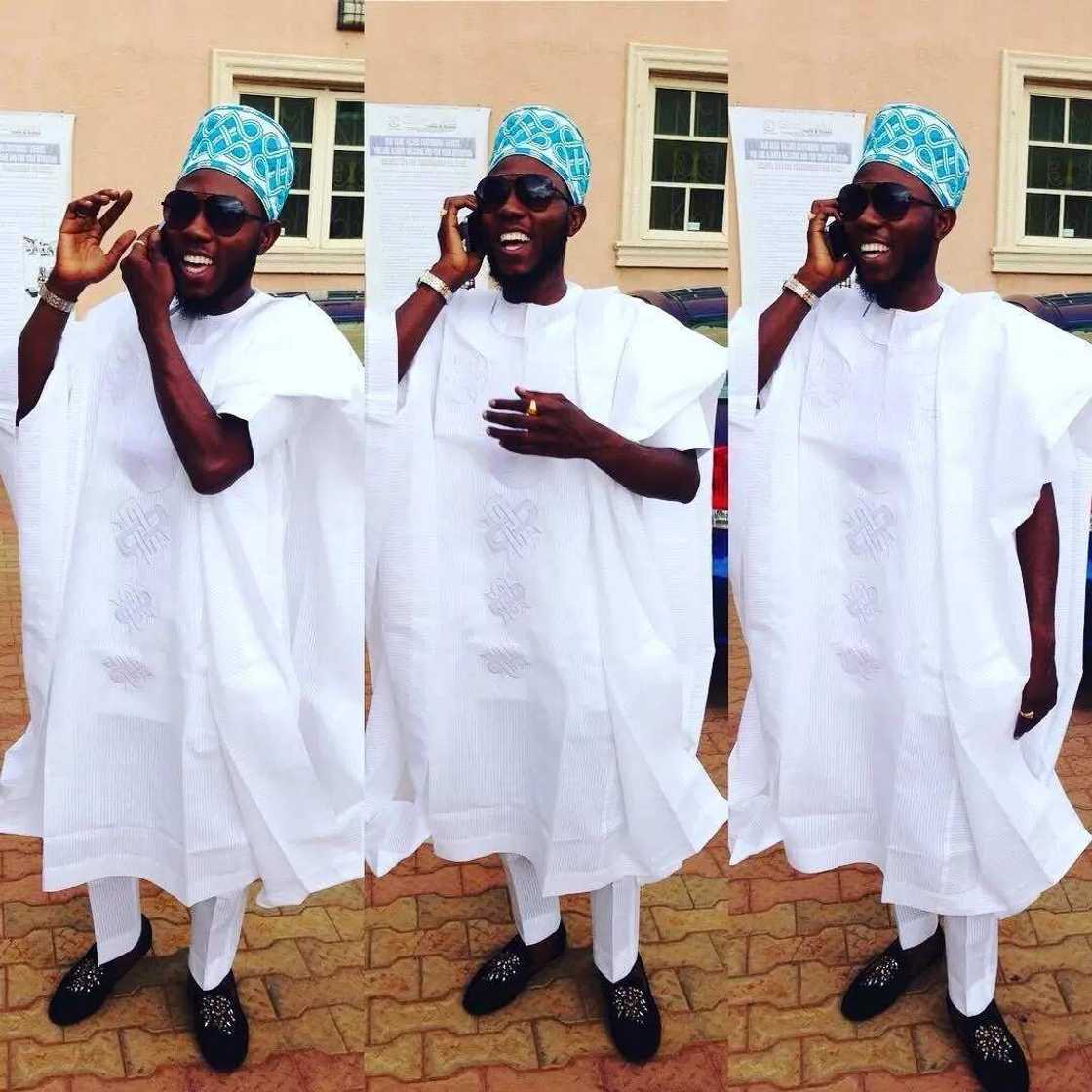 White Agbada style for guys with white embroidery White Agbada style for guys with white embroidery