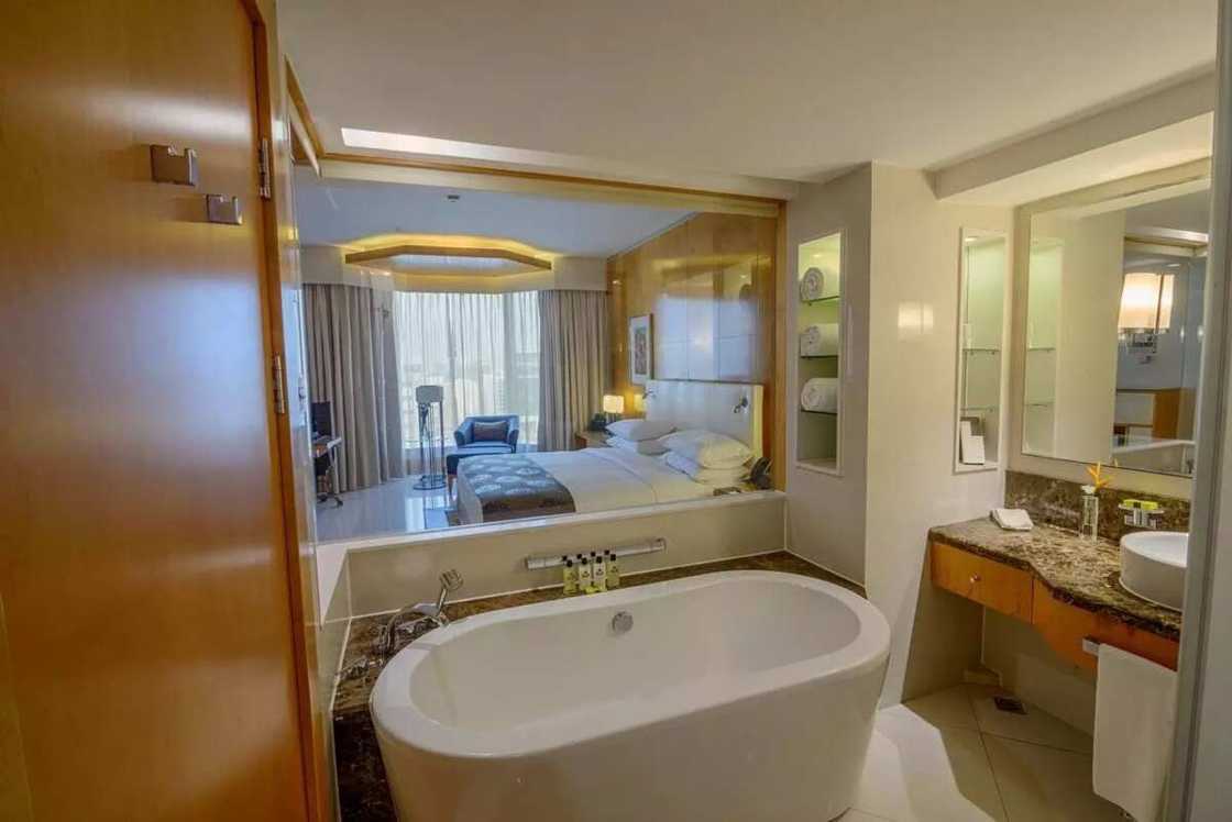 A bathroom is behind the glass wall A bathroom is behind the glass wall
