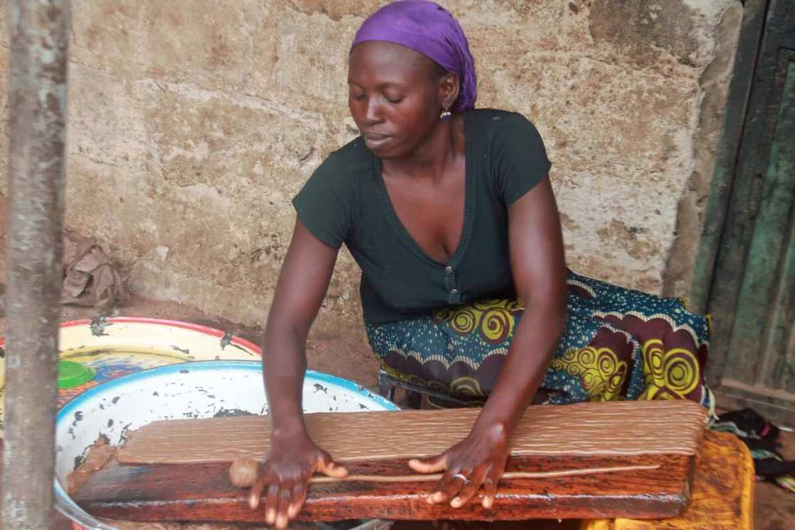 Nigerian woman cooking kuli kuli Nigerian woman cooking kuli kuli