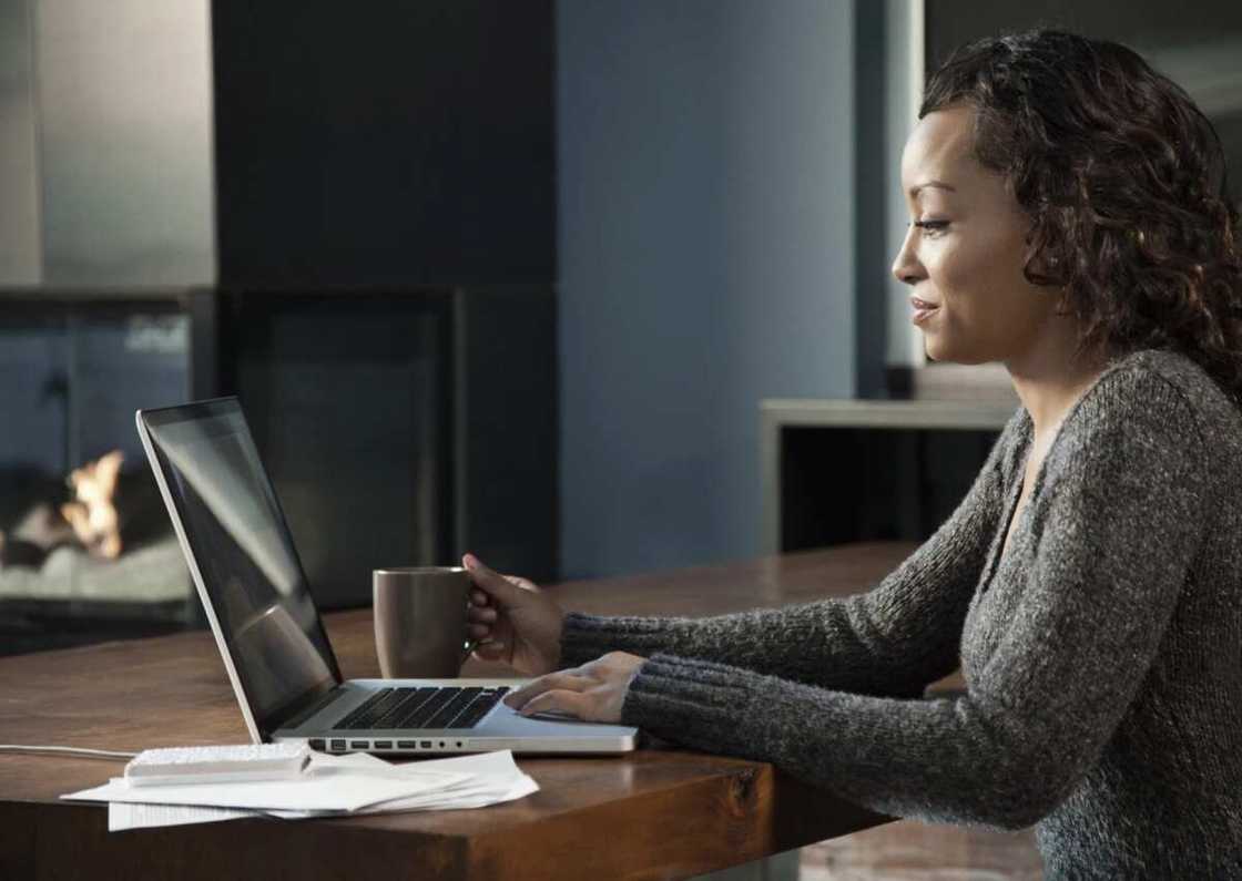 Woman paying on laptop