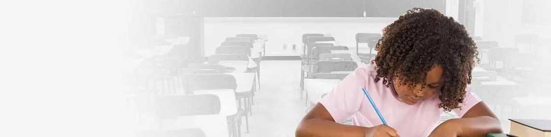 A boy writes an exam A boy writes an exam