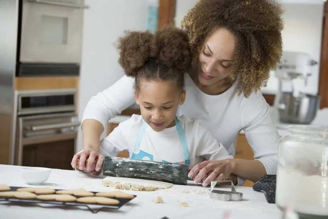 Mother and daughter are cooking