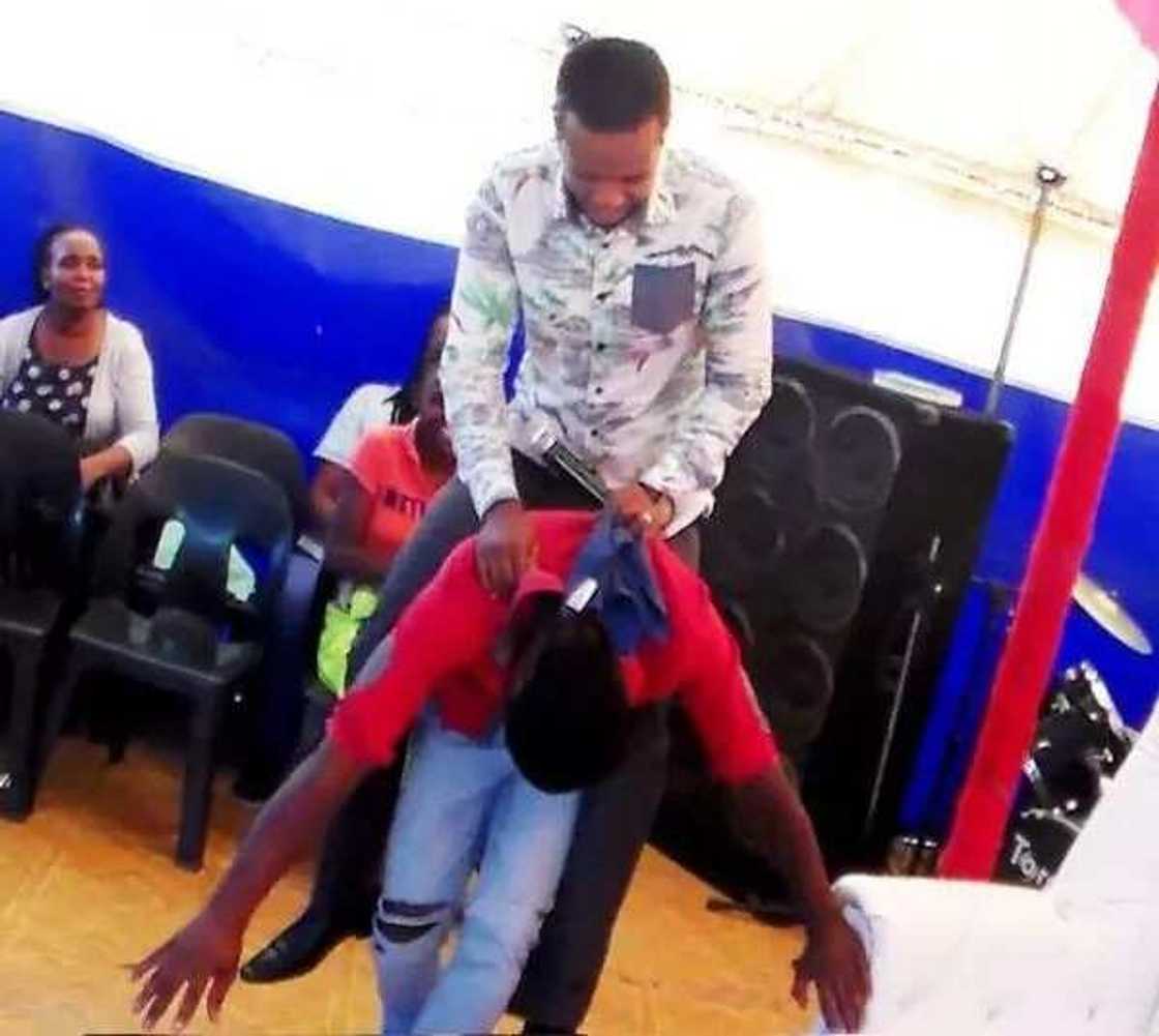 Pastor Penuel Mnguni rides member like a horse (photos)