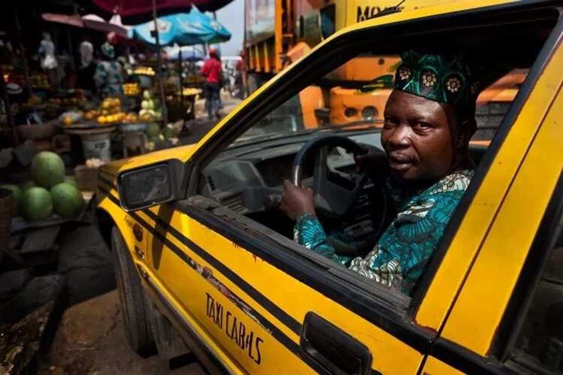 The Uber taxi is slowly taking over business from the traditional yellow cab drivers in Lagos The Uber taxi is slowly taking over business from the traditional yellow cab drivers in Lagos