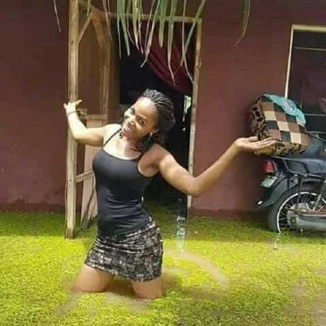 Young lady strikes a pose in front of her house as flood overtakes it in Benue state (photos) Young lady strikes a pose in front of her house as flood overtakes it in Benue state (photos)