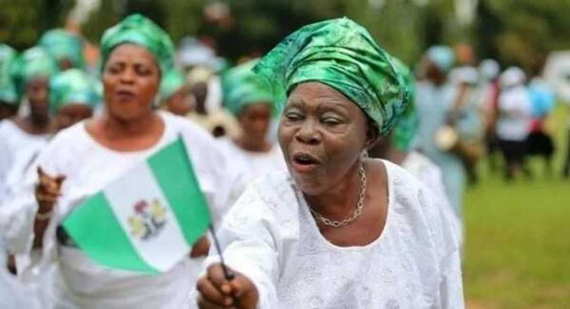 Nigerian woman with a flag