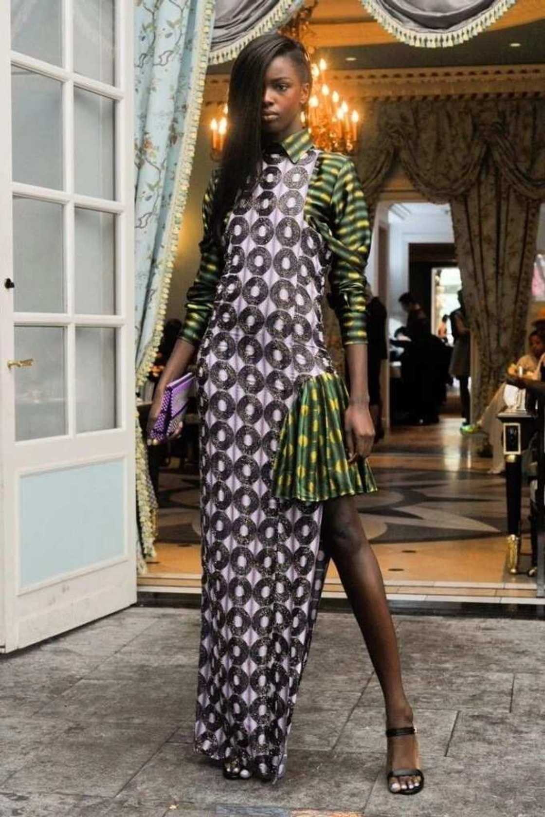 Long gown with a pleated element Long gown with a pleated element