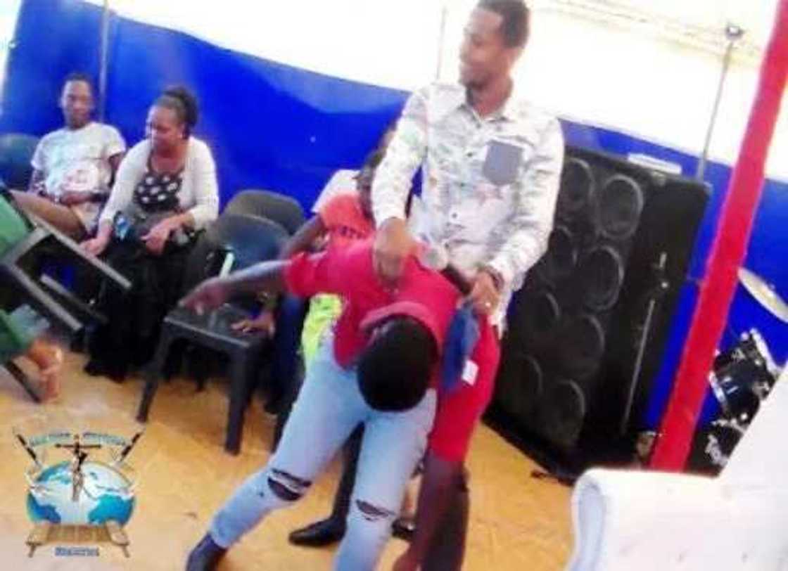 Pastor Penuel Mnguni rides member like a horse (photos) Pastor Penuel Mnguni rides member like a horse (photos)