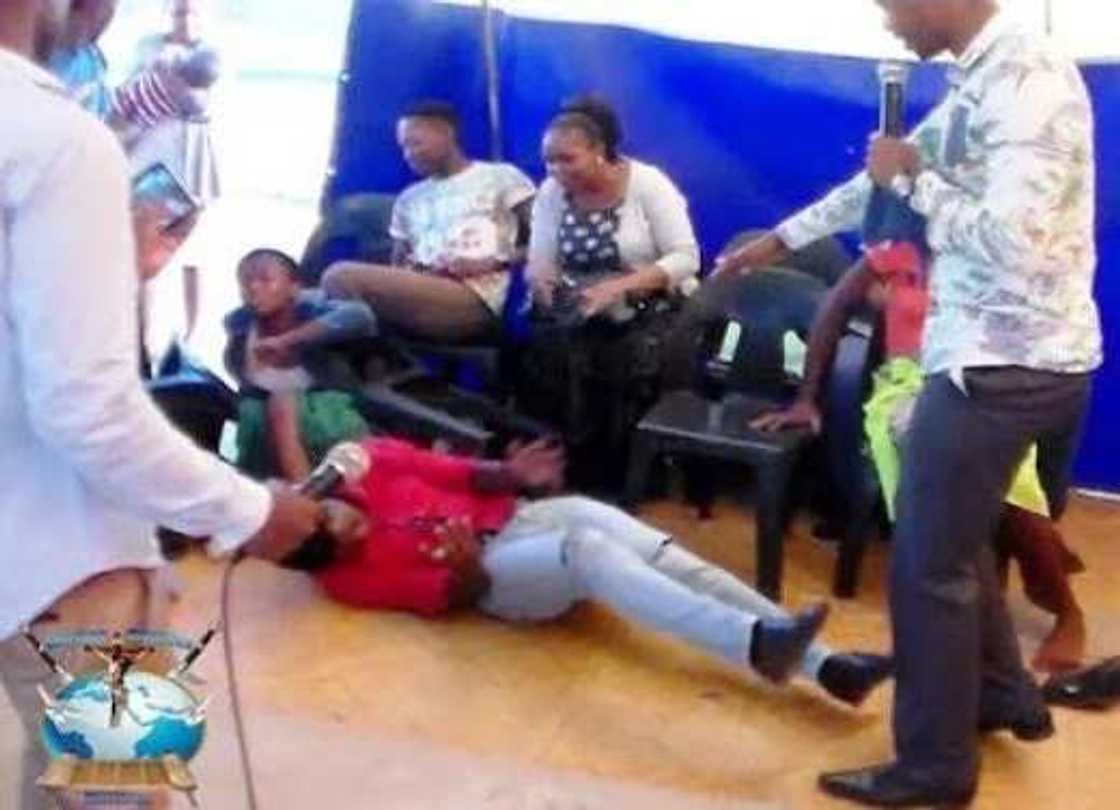 Pastor Penuel Mnguni rides member like a horse (photos) Pastor Penuel Mnguni rides member like a horse (photos)