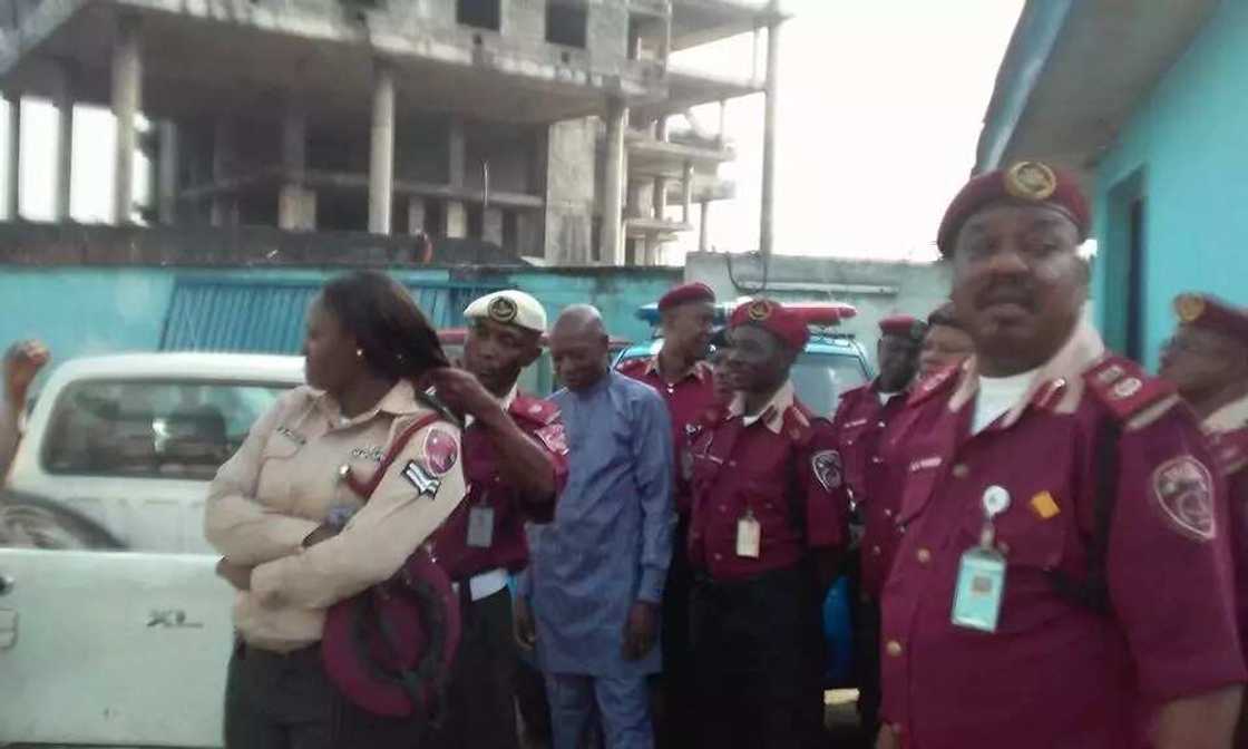 FRSC Sector Commander cutting off female officers' hairs FRSC Sector Commander cutting off female officers' hairs