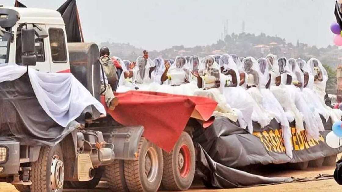 200 brides ride in a truck to their mass wedding in Uganda