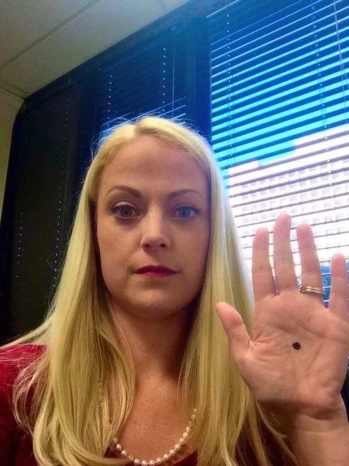 If you notice someone with a black dot on the palm, call the police immediately! If you notice someone with a black dot on the palm, call the police immediately!