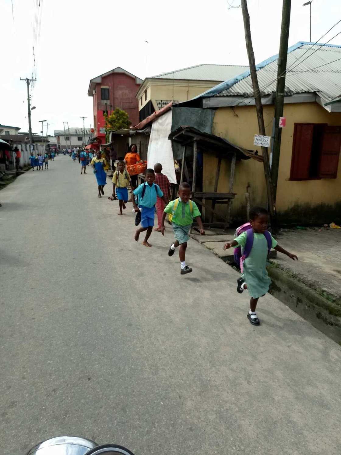 Pupils running home over fresh army vaccination in Rivers state. Photo credit: Anthony D. Penman Pupils running home over fresh army vaccination in Rivers state. Photo credit: Anthony D. Penman