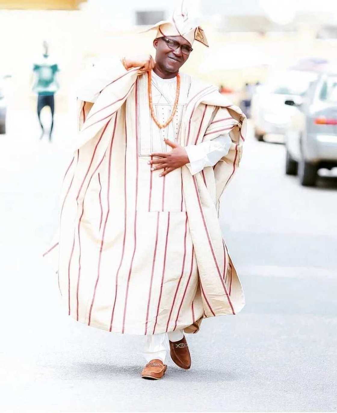 White agbada styles with strips White agbada styles with strips