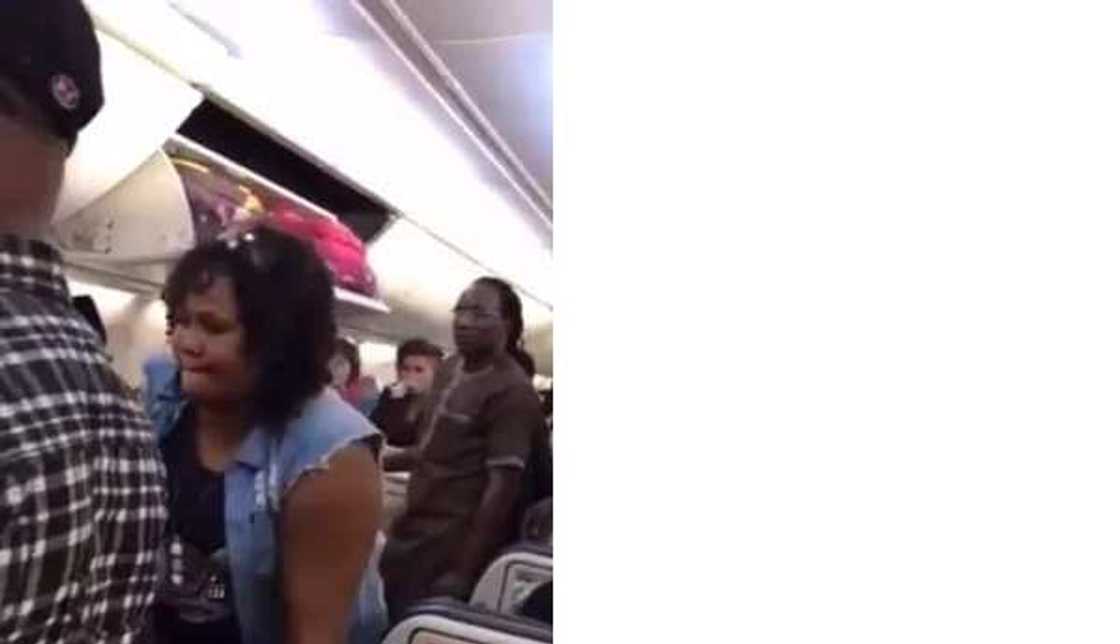 Nigerian lady kicked off Turkish flight for assaulting air hostess (photos, video)