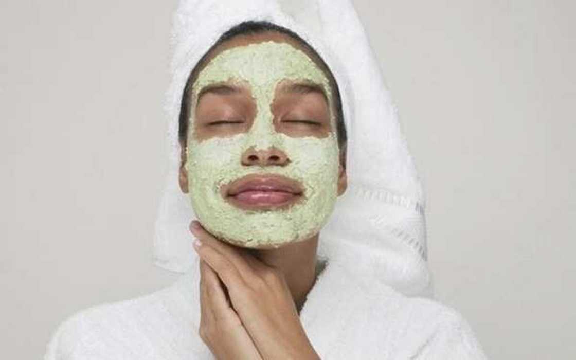 woman with green face mask woman with green face mask