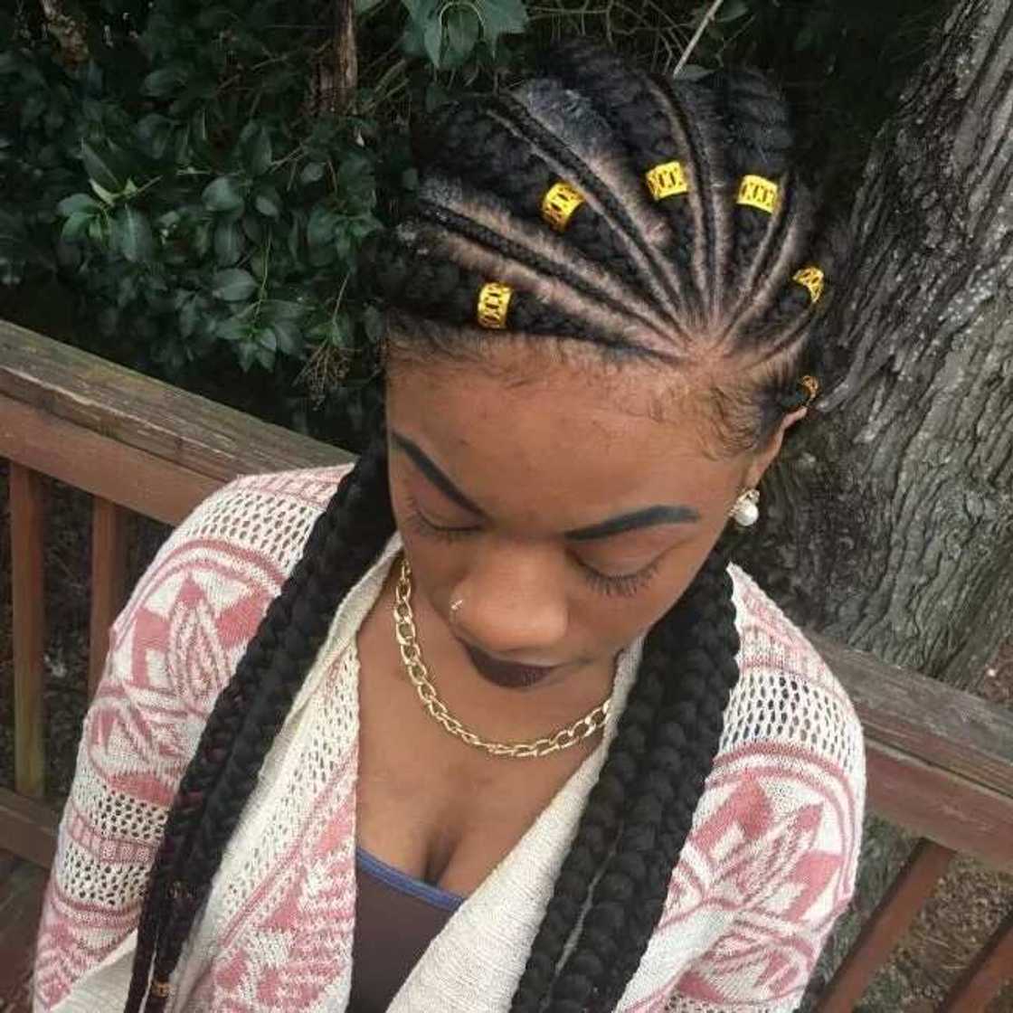 Nigerian braids with golden accessories for round face Nigerian braids with golden accessories for round face