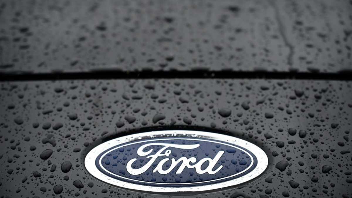 Ford profits tumble on higher costs, hitting shares