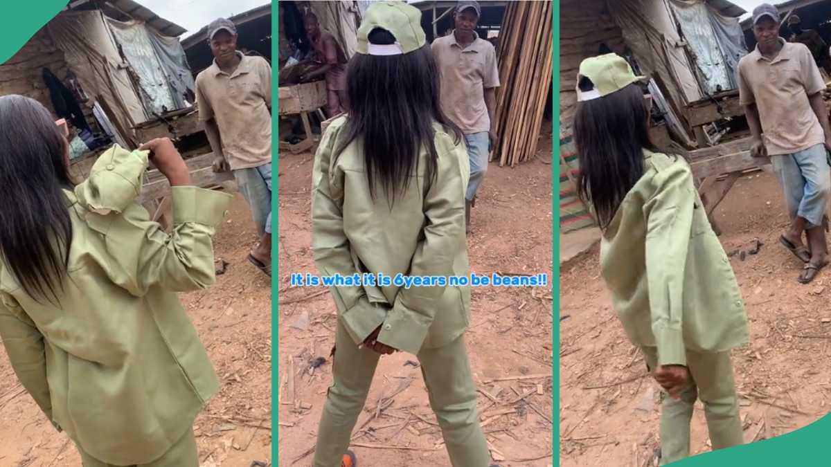 Female corper surprises her dad at his workshop in her NYSC khaki, marches before him in video