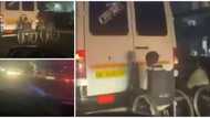 Two physically challenged men on wheelchairs take risk, cling to the back of moving vehicle in viral video