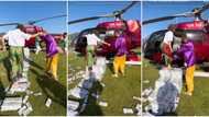 "Can she ever finish the money?" Wealthy lady walks on bundles of cash as she enters jet, video causes stir
