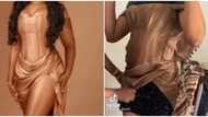 What I ordered: Video of lady struggling to fit into undersized dress sparks hilarious reactions