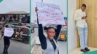 Nigerian lady storms street with placard begging people to patronise her brother's business