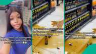 Beautiful lady taking pictures at supermarket accidentally broke bottles of drinks