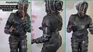 "No body contact": Okrika seller wraps herself with cellophane before modelling her clothes in video