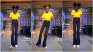 Trending video as tall girl in long trousers and yellow top impresses people with her happy feet dance moves