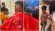 Wizkid takes son Zion for his first haircut, gushes over little boy as he debuts new look in adorable videos