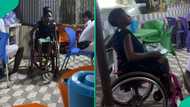 Hardworking girl in wheelchair helps mother serve food to customers in touching video, people react