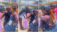 "Safe journey": Lady sheds tears in public as her parents lay hands on her in prayer before she travels