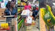"N290,000 in 30 seconds": Smart woman carries bags of rice during free shopping spree in supermarket