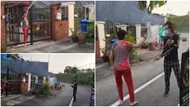 Woman surprises her debt collectors, pours water on them using a hose, video causes stir