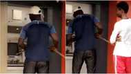 Coronavirus pandemic forces man to operate ATM with stick (video)