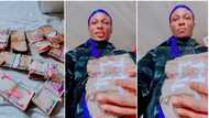 "I'm tired of saving money, I want to squander, is Dangote not man like me?" Man says, displays cash in video