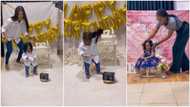 Kid refuses to allow anything stay on her head during birthday photoshoot, removes wig mum gave her