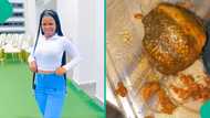 Nigerian lady cries out after buying food from "mama put," shows confusing meat she was given