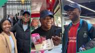 Lady takes her father on tour of UK, they visit Anfield Stadium in Liverpool and Buckingham Palace