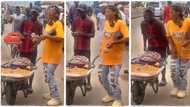 "You want him to run?" Slim lady in ripped jeans dances for tiger nuts hawker on the road, video emerges